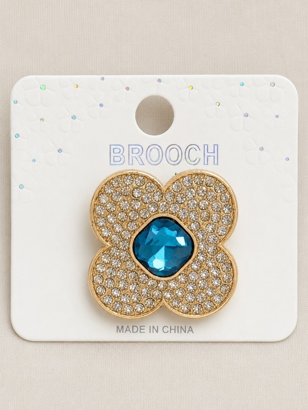Gold Tone Rhinestone Flower Brooch Pin with Iridescent Crystal Center Blue